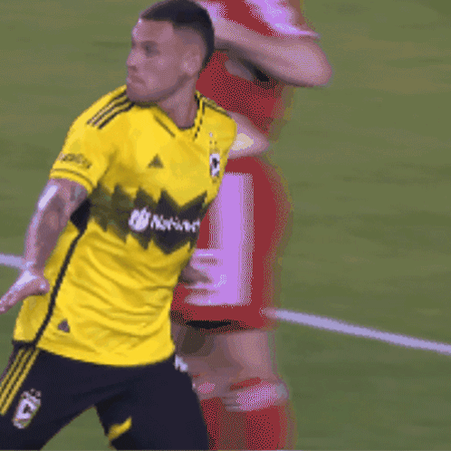 Soccer Player in Yellow Nationals Shirt