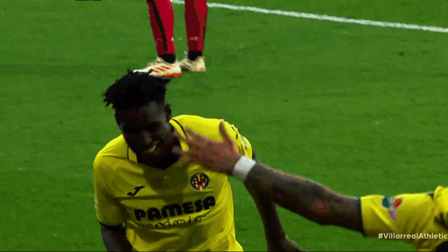 Soccer Player in Yellow Pamesa Shirt