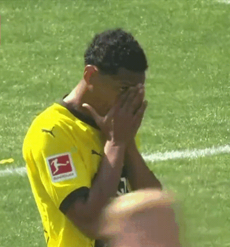 Soccer Player in Yellow Puma Shirt