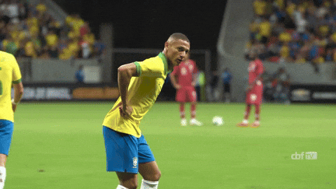 Soccer Player in Yellow Shirt and Blue Shorts