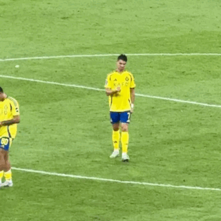 Soccer Player in Yellow Shirt with Kafl