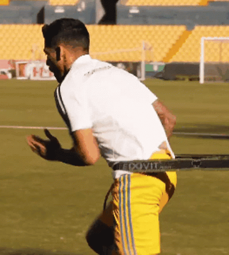 Soccer Player In Yellow Shorts And White Shirt GIF