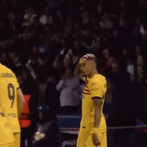 Soccer Player in Yellow Spotify Jersey