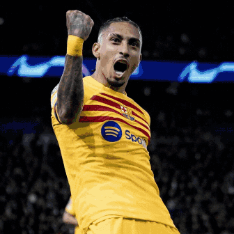 Soccer Player in Yellow Spotify Shirt