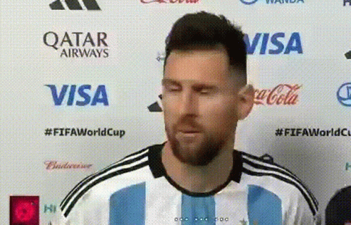 Soccer Player Interviewed at Qatar Airways Visa Coca-Cola Banner