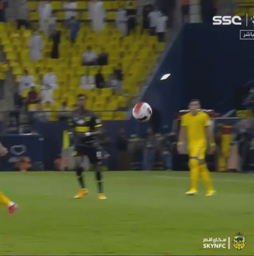 Soccer Player Kicking A Ball In Front Of A Sign That Says Ssc GIF