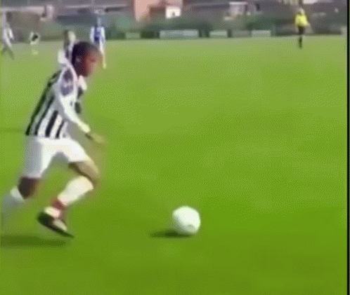 Soccer Player Kicking Ball