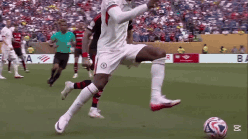 Soccer Player Kicking Ball by Banner Saying ba