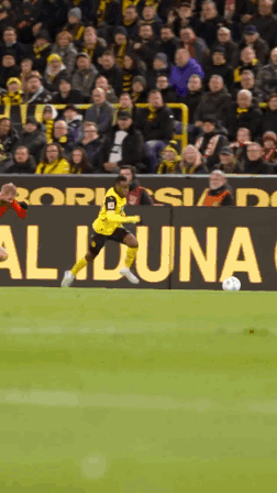 Soccer Player Kicking Ball in Front of Aliona Sign