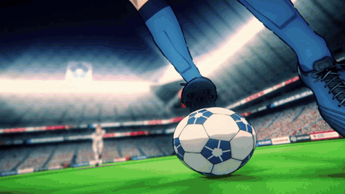 Soccer Player Kicking Ball in Stadium With UEFA Sign