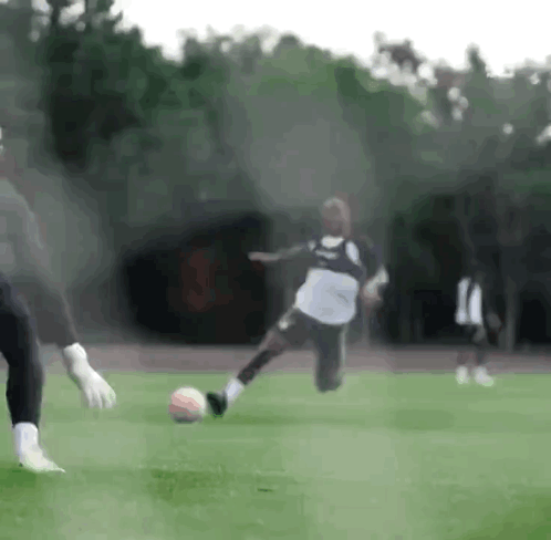 Soccer Player Kicking Ball