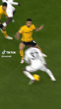 Soccer Player Kicking Yellow Ball