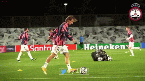 Soccer Player Kicks Ball Heineken Sign GIF