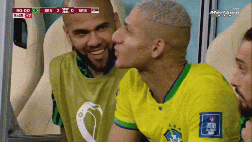 Soccer Player Kissing Teammate on Cheek