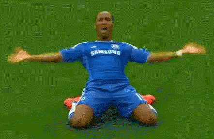 Soccer Player Kneeling in Blue Samsung Jersey