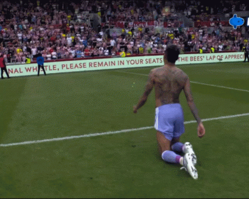 Soccer Player Kneeling in Front of Please Remain in Seats Sign