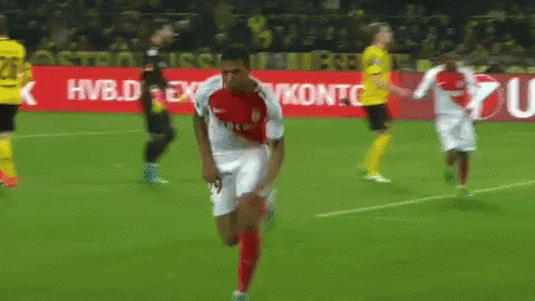 Soccer Player Kneeling in Front of Unicredit Sign