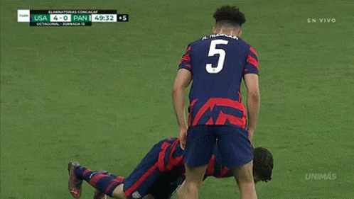 Soccer Player Laying On Ground Against Pan GIF
