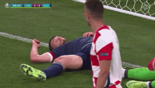 Soccer Player Laying On Ground Other Standing GIF