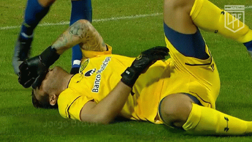 Soccer Player Laying On Ground With Banco Municipal GIF