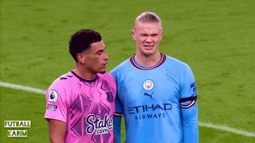 Soccer Player Laying, Two Others Talking And Watching GIF