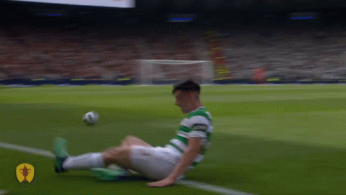 Soccer Player Lying Kicking Ball