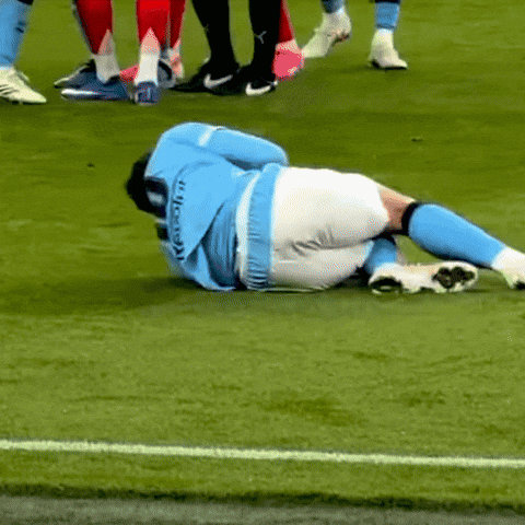Soccer Player Lying On Ground GIF