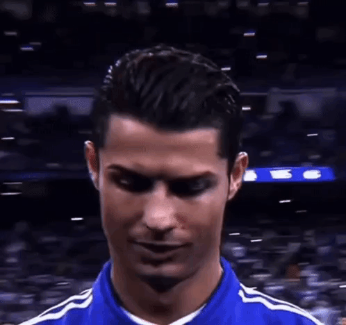 Soccer Player Making Funny Face in Blue Shirt
