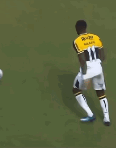 Soccer Player Number 11 Kicks Ball GIF