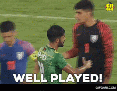 Soccer Player Number 11 Shaking Hands With Another Player