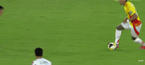 Soccer Player Number 14 Dribbling Ball