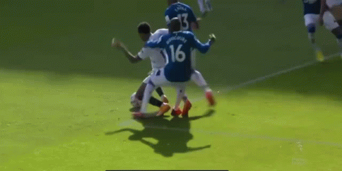 Soccer Player Number 16 Tackled