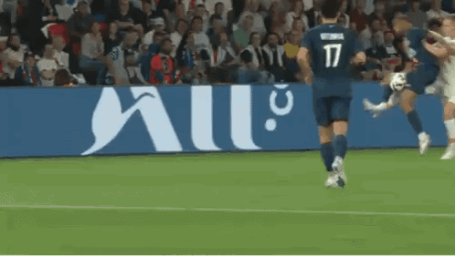 Soccer Player Number 17 Kicking Ball