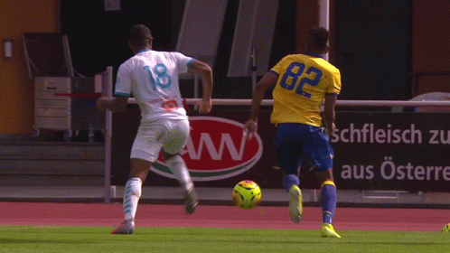 Soccer Player Number 18 Kicking Ball GIF