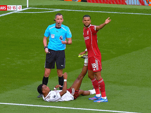 Soccer Player Number 18 Lying on Ground