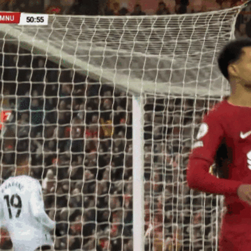 Soccer Player Number 19 in Front of Goal