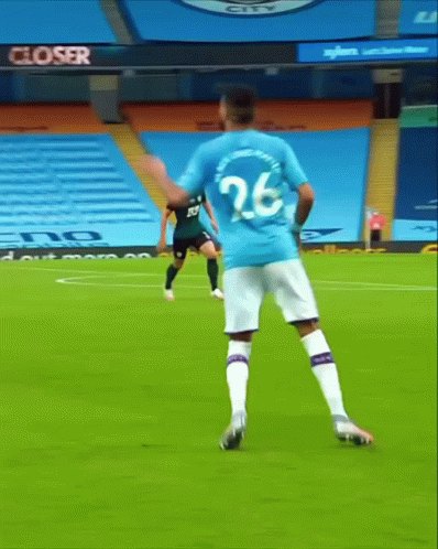 Soccer Player Number 20 Kicking Ball