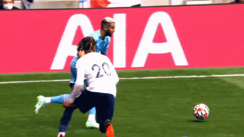 Soccer Player Number 20 Kicking Ball