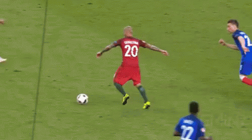 Soccer Player Number 21 Kicking Ball