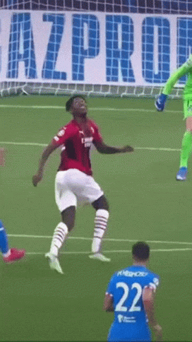 Soccer Player Number 22 Jumping in the Air