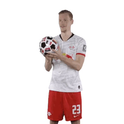 Soccer Player Number 23 Holding Ball