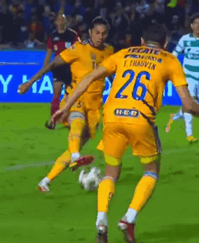 Soccer Player Number 26 Kicking Ball