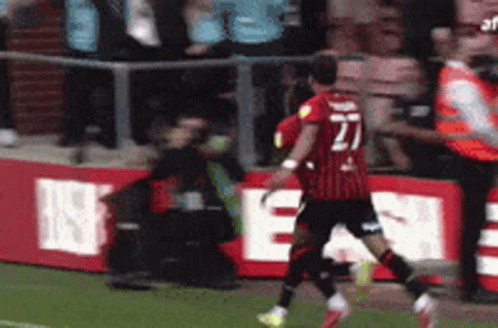 Soccer Player Number 27 Running
