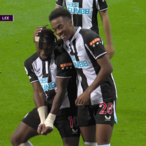 Soccer Player Number 28 Hugging Another Player GIF