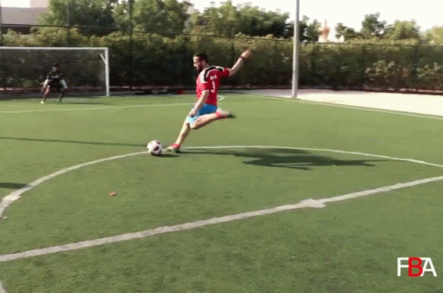 Soccer Player Number 3 Kicking Ball