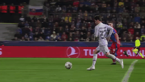 Soccer Player Number 34 Kicking Ball