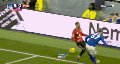 Soccer Player Number 37 Kicking Ball