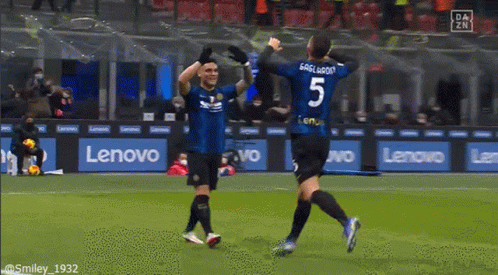 Soccer Player Number 5 Celebrating With Teammate
