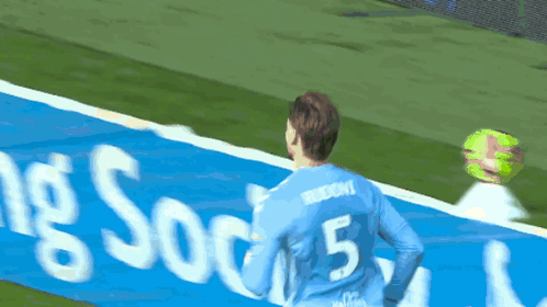 Soccer Player Number 5 Hugging Another Player GIF