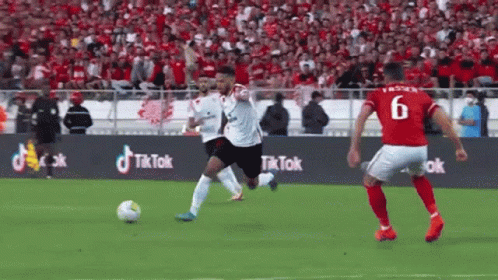 Soccer Player Number 6 Kicking Ball
